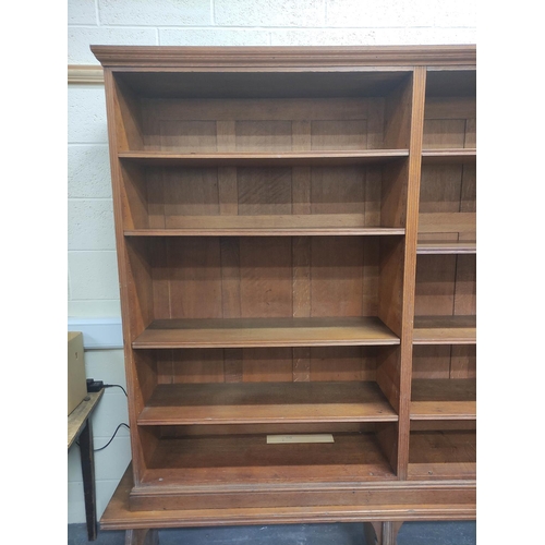 390 - Oak open library bookcase, c.1870's, in the manner of Philip Webb, the moulded pediment above three ... 