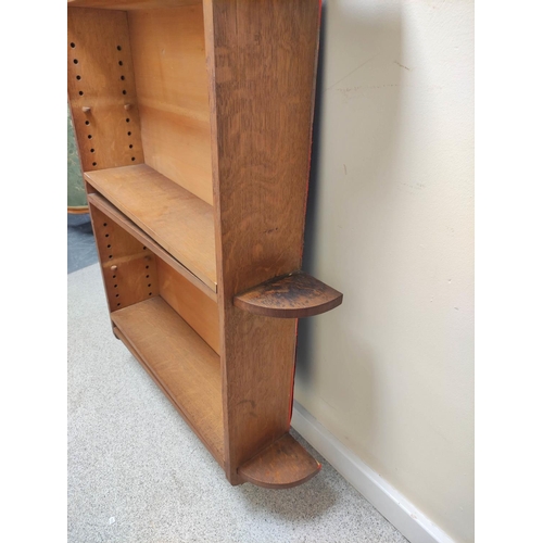 394 - Late 19th century oak wall hanging open book shelves in  the Arts and Crafts manner, adjustable... 