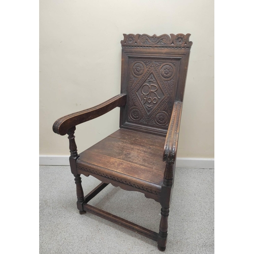 395 - Oak wainscot chair, c.1900, with panel back and solid seat, carved CR 1900 (Charles Roberts MP) and ... 