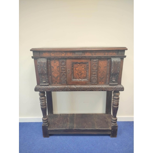 403 - Early 17th century style oak buffet, the carved inlaid front fitted with cupboards and inlaid decora... 