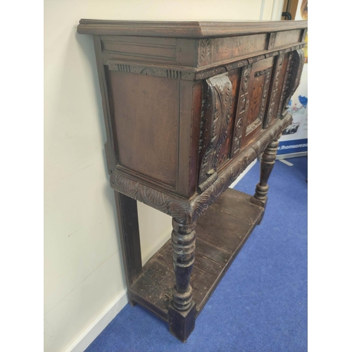 403 - Early 17th century style oak buffet, the carved inlaid front fitted with cupboards and inlaid decora... 