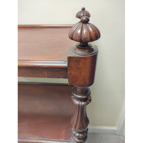 413 - Victorian  mahogany buffet table, with open tiers, on turned columns and reeded finials, on castors,... 