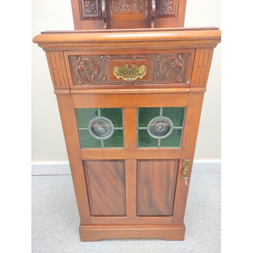 419 - Edwardian mahogany music cabinet with mirrored pediment above a single drawer and door inset with tw... 