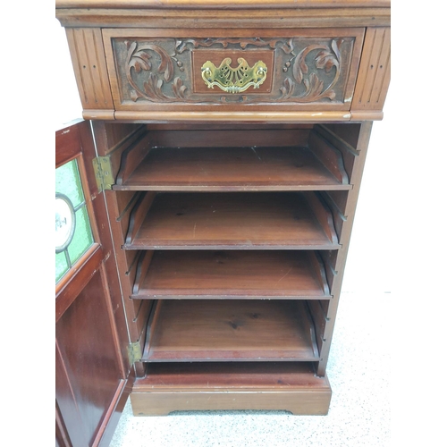 419 - Edwardian mahogany music cabinet with mirrored pediment above a single drawer and door inset with tw... 