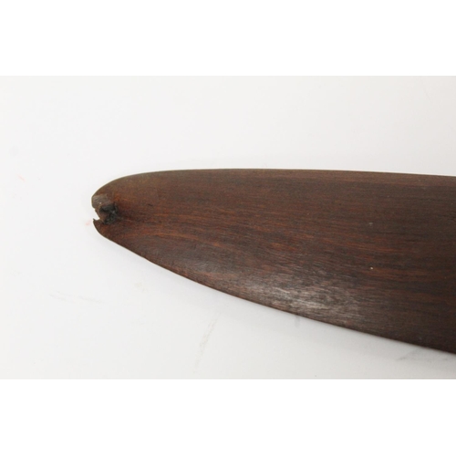 354 - Antique hardwood boomerang of plain curved form, 65cm long, some damages.