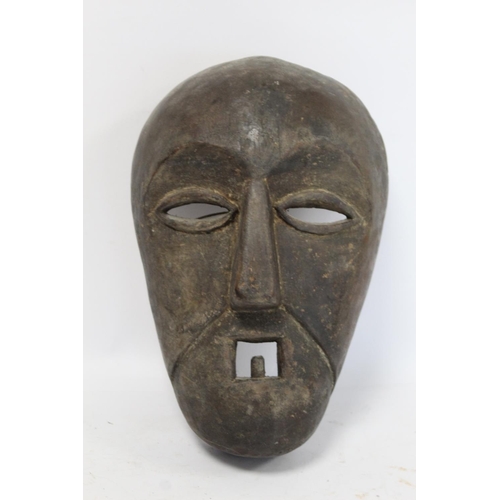 361 - African tribal carved wooden mask with arched brows, elliptical lidded eyes, triangular nose and squ... 