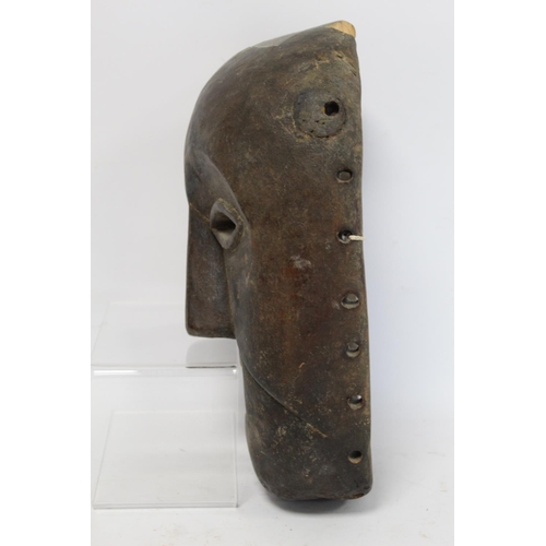 361 - African tribal carved wooden mask with arched brows, elliptical lidded eyes, triangular nose and squ... 