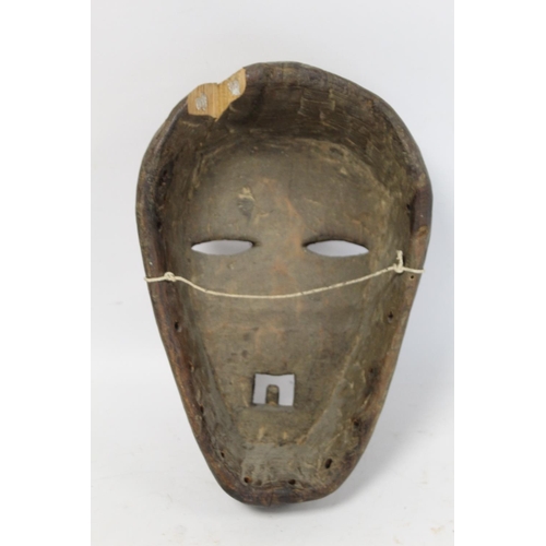 361 - African tribal carved wooden mask with arched brows, elliptical lidded eyes, triangular nose and squ... 