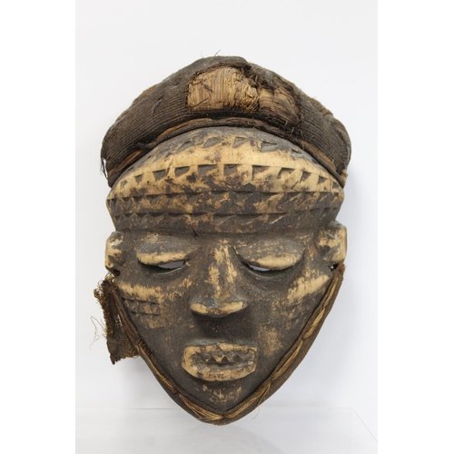 362 - African tribal mask with geometric incised banding to forehead and cheeks, protruding eyelids, nose ... 