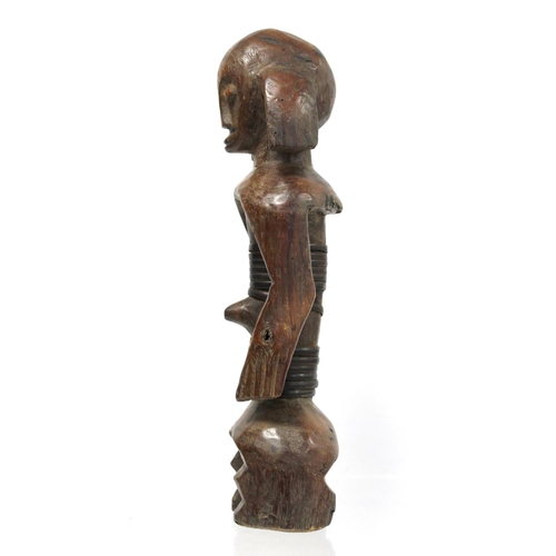 364 - African tribal carved hardwood standing figure, possibly Fang, the torso with cane binding, 33cm hig... 