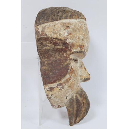 365 - African tribal DRC Soko Mutu Hemba carved mask, 30cm long and another decorated with white and red p... 