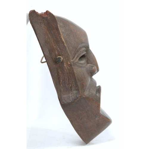 366 - African carved hardwood monkey mask decorated with white and red pigments, with cane binding and fri... 