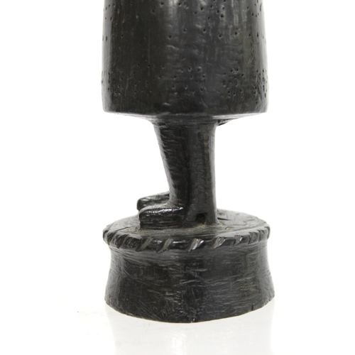 369 - Ethnic, probably African, carved ebony standing figure of a man (European missionary / priest?) on c... 