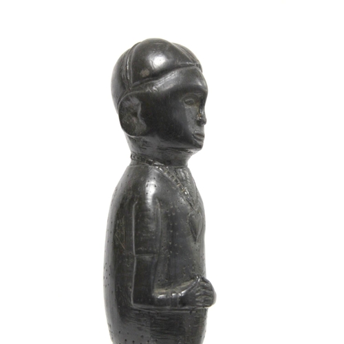 369 - Ethnic, probably African, carved ebony standing figure of a man (European missionary / priest?) on c... 