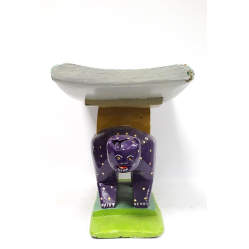 372 - African Asante leopard stool of typical form with modern bright polychrome painted decoration, 59cm ... 