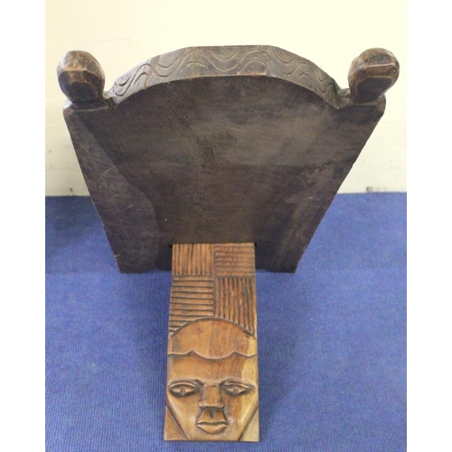 373 - Modern African Nigerian carved hardwood folding chair in two parts, the arched top with mask head fi... 