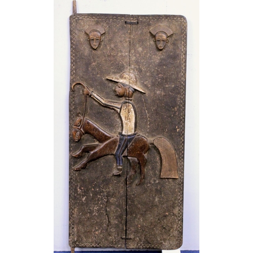 374 - African carved wooden door, probably Dogon, Mali, depicting a man riding a horse in European clothes... 