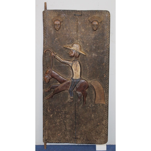 374 - African carved wooden door, probably Dogon, Mali, depicting a man riding a horse in European clothes... 