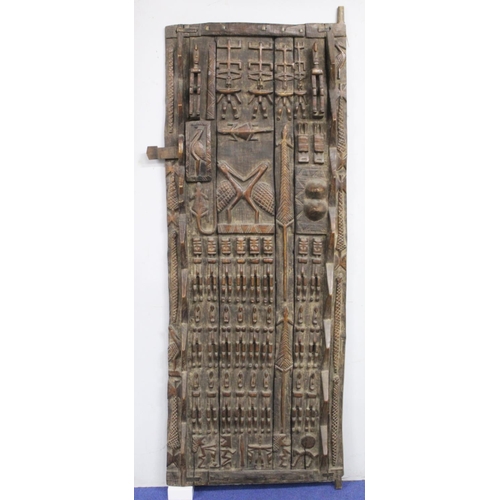 375 - African carved wooden door, probably Dogon, Mali, profusely decorated with figures and animals, 185c... 