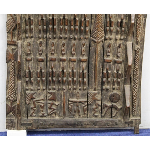 375 - African carved wooden door, probably Dogon, Mali, profusely decorated with figures and animals, 185c... 