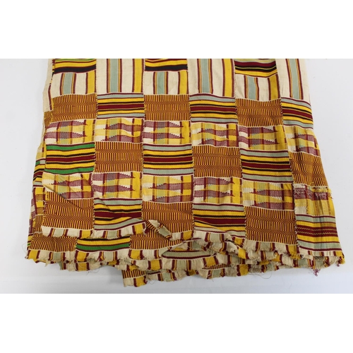 377 - African Asanti Kente cloth in woven silk and cotton striped fabrics in predominantly yellow, cream, ... 