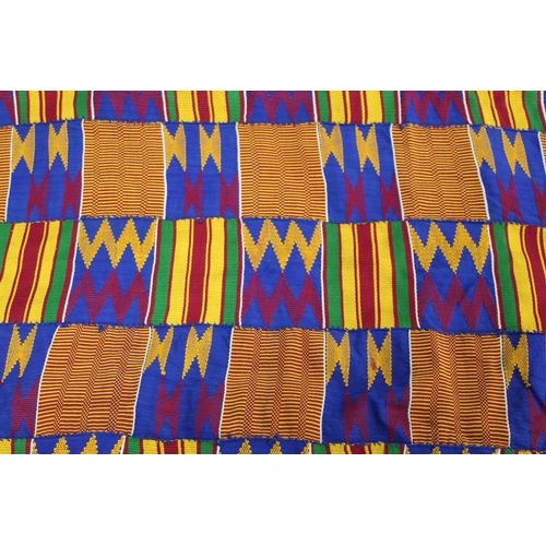 378 - African Asanti Kente cloth in woven silk and cotton fabrics in predominantly blue, yellow, green and... 