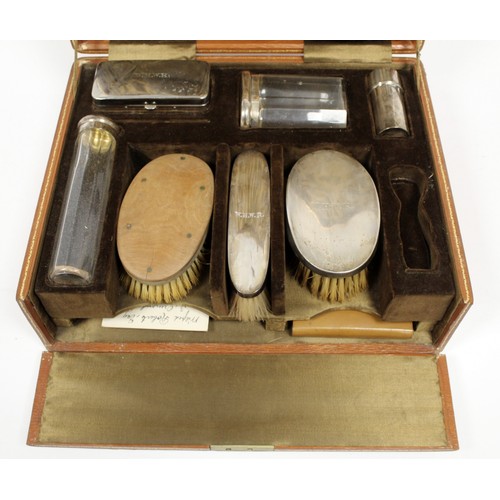 168A - 1920s gentleman's travelling toilette set in fitted leather case, with silver backed brushes, silver... 