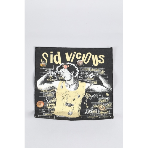 261 - Sid Vicious advertising poster together with five pin badges