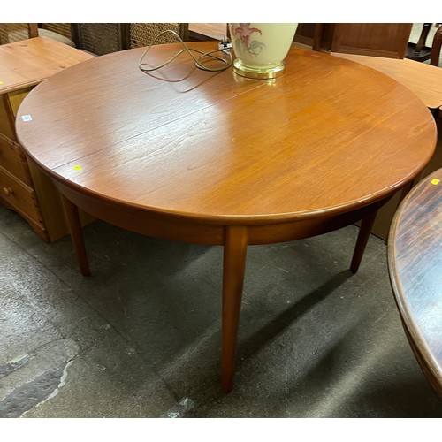 631 - Teak extending circular dining table