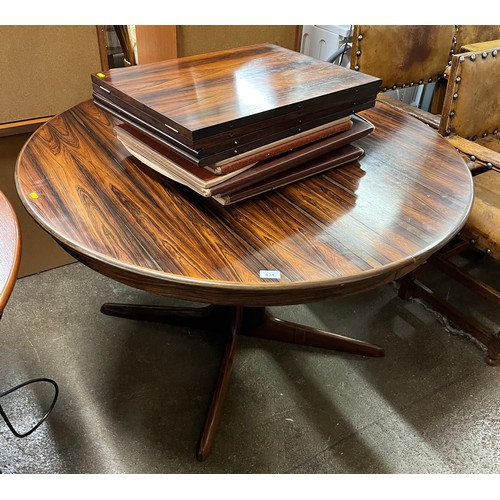 634 - Extending circular rosewood dining table