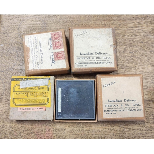 83 - Four cartons of approx 28 mixed monochrome & colour glass slides including religious and moral s... 