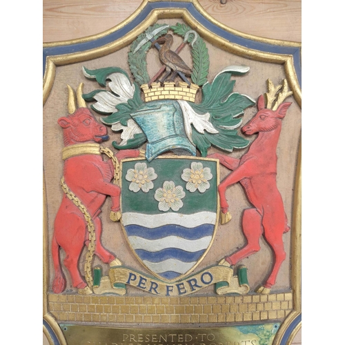 72 - A presentation carved painted wooden armorial plaque to Charles Henry Roberts, 4th November 1953, ma... 