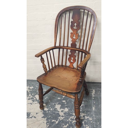 406 - Ash and elm Windsor armchair, the hoop frame with spindle back and pierced splat, raised on turned s... 