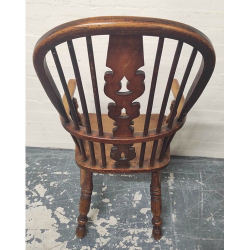 406 - Ash and elm Windsor armchair, the hoop frame with spindle back and pierced splat, raised on turned s... 