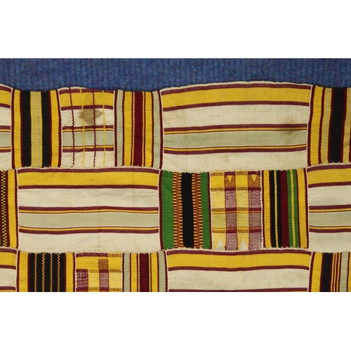 377 - African Asanti Kente cloth in woven silk and cotton striped fabrics in predominantly yellow, cream, ... 