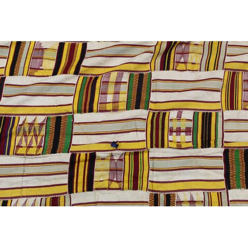 377 - African Asanti Kente cloth in woven silk and cotton striped fabrics in predominantly yellow, cream, ... 