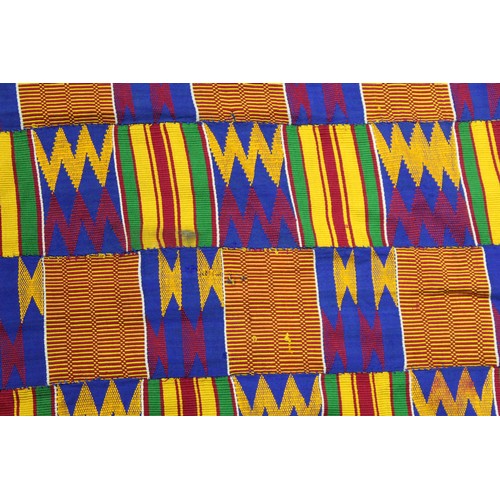 378 - African Asanti Kente cloth in woven silk and cotton fabrics in predominantly blue, yellow, green and... 