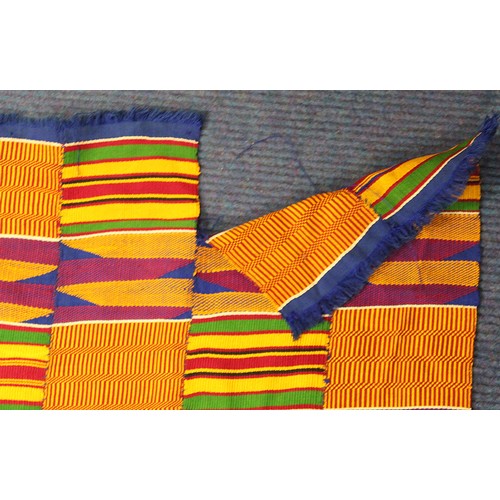 378 - African Asanti Kente cloth in woven silk and cotton fabrics in predominantly blue, yellow, green and... 