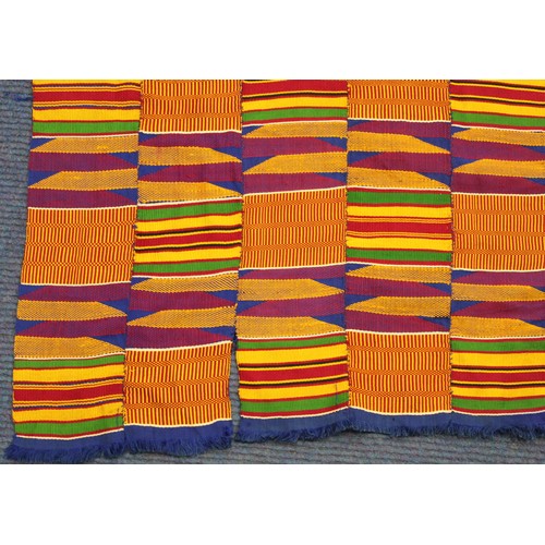 378 - African Asanti Kente cloth in woven silk and cotton fabrics in predominantly blue, yellow, green and... 