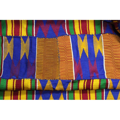 378 - African Asanti Kente cloth in woven silk and cotton fabrics in predominantly blue, yellow, green and... 