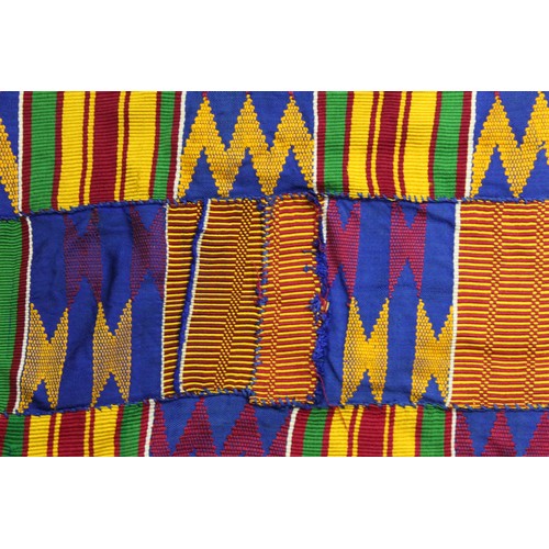 378 - African Asanti Kente cloth in woven silk and cotton fabrics in predominantly blue, yellow, green and... 