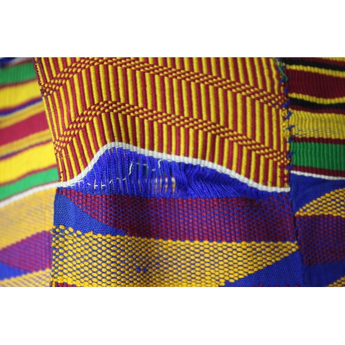 378 - African Asanti Kente cloth in woven silk and cotton fabrics in predominantly blue, yellow, green and... 