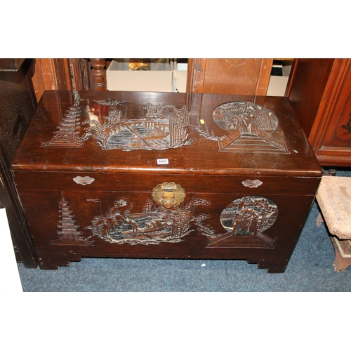 662 - Heavily carved oriental hardwood blanket box, 90cm wide x 49cm tall.