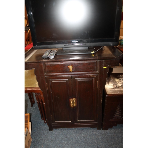 663 - Oriental hardwood cabinet with shaped ends.