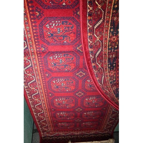 674 - Handmade Persian Tribal red ground fringed multi bordered rug, 160cm x 120cm.