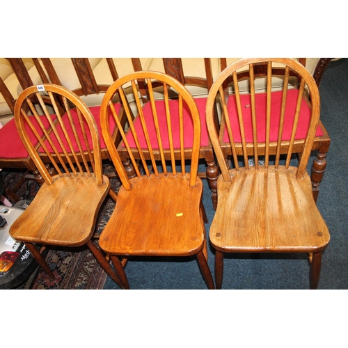 686 - Set of three spindle back dining chairs.