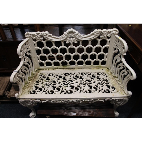 695 - Cast iron garden bench with arched back and shaped top, 116cm wide.