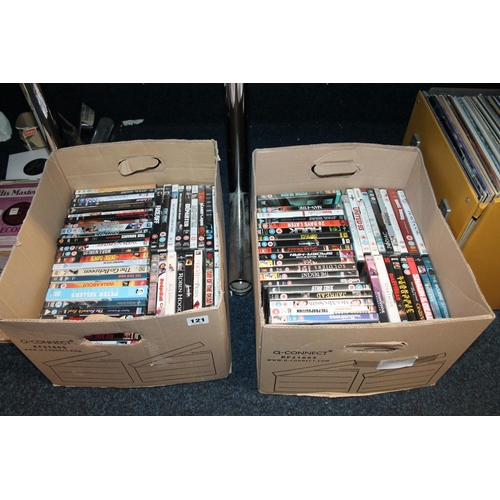 121 - Two boxes containing DVDs.