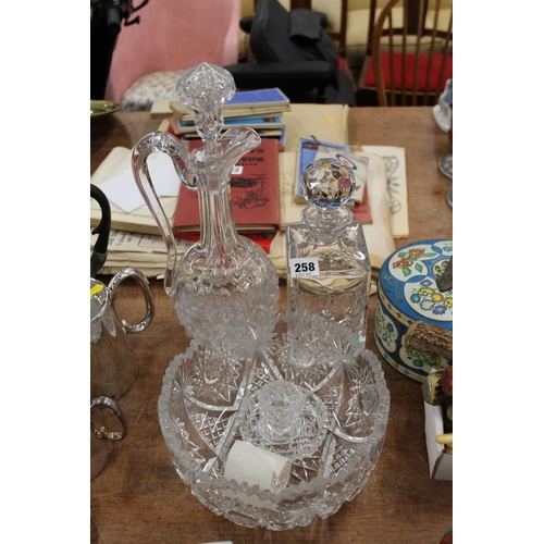 258 - Heavily cut crystal bowl, two decanters, etc.