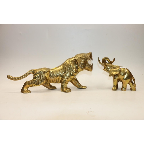 39 - Brass model of a tiger, 39cm long and a brass model of an elephant 15cm.